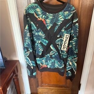 10.Deep Black Tropical Leaf Crewneck Sweater with Teal Accents